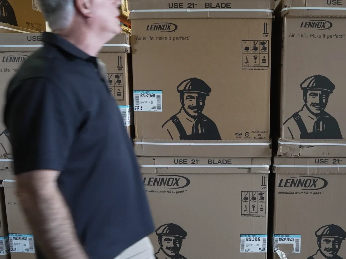 Stacks of boxed Lennox units in the Gilley's warehouse