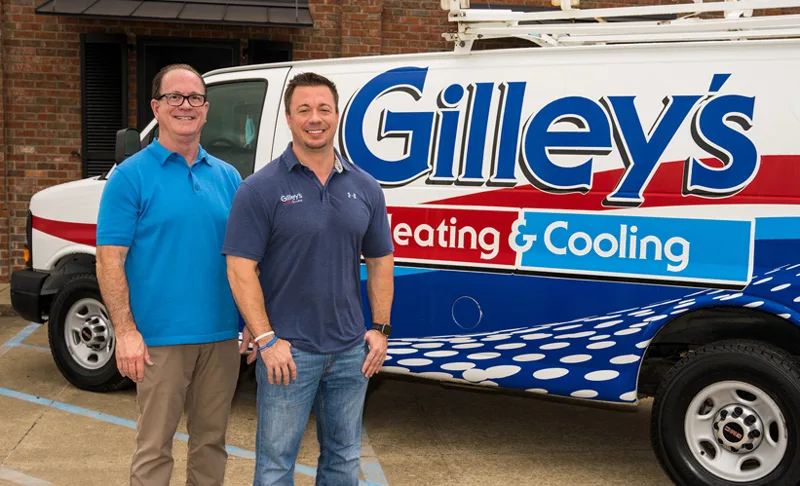Randy Gilley and Randall Gilley Jr. in front of a Gilley's van